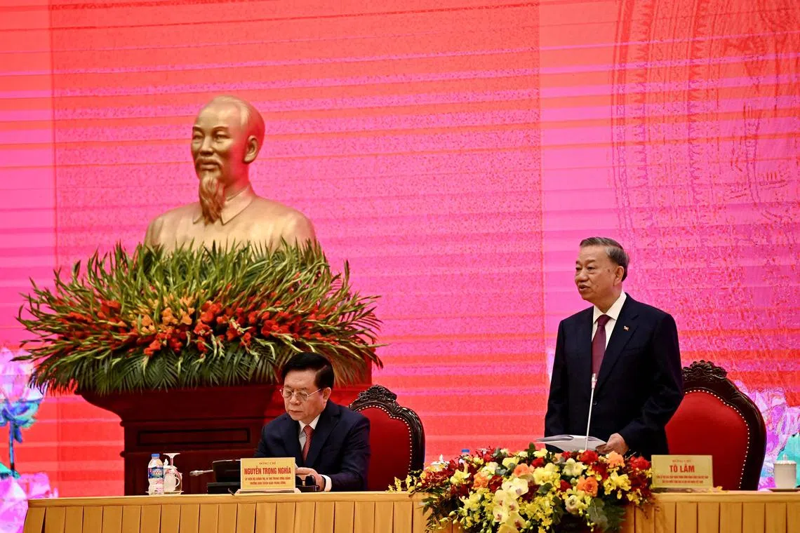 General Secretary of the Communist Party of Vietnam and President To Lam (right) speaks during a press conference at the National Convention Center in Hanoi on Aug 3.