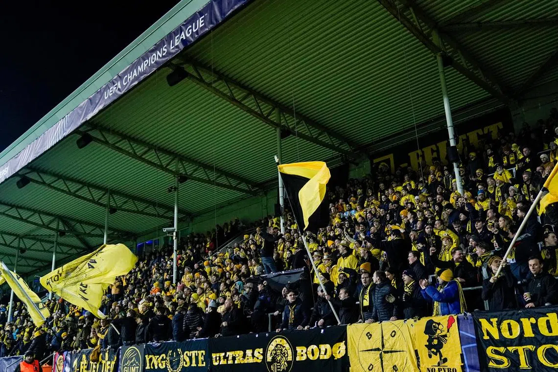Soccer - UEFA Champions League - Round of 16 - First Leg - Bodo/Glimt v Sporting CP - Aspmyra Stadion, Bodo, Norway - March 11, 2026 Bodo/Glimt fans in the stands before the match Fredrik Varfjell/NTB via REUTERS