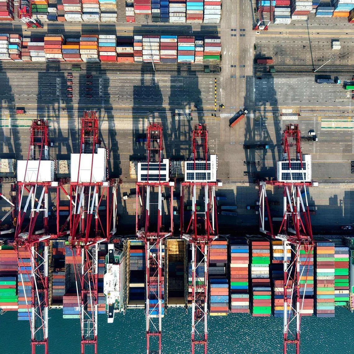 A container ship is seen at berth at the container terminal of the port in Qingdao, in China’s eastern Shandong province, on April 2.