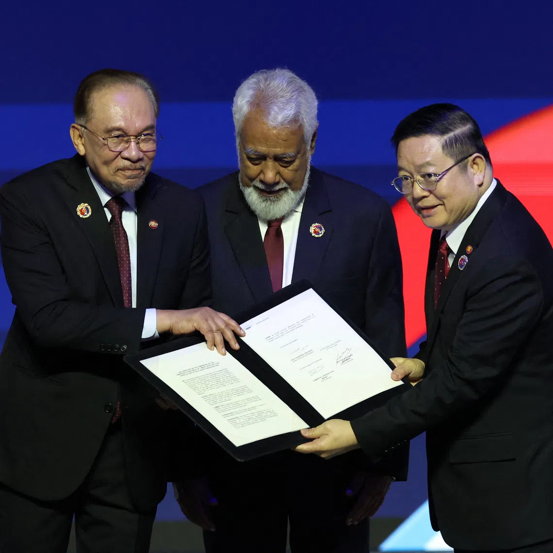 Malaysia's Prime Minister Anwar Ibrahim (left), China’s Premier Li Qiang (right) and Timor-Leste's Prime Minister Kay Rala Xanana Gusmao during the signing ceremony on Oct 26.