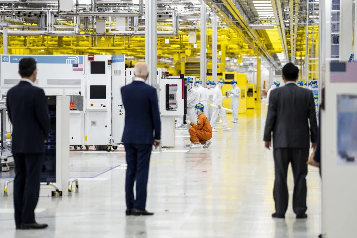 US President Joe Biden, accompanied by South Korean President Yoon Suk Yeol and Samsung chairman Lee Jae-yong tour a semiconductor facility in Pyeongtaek.
