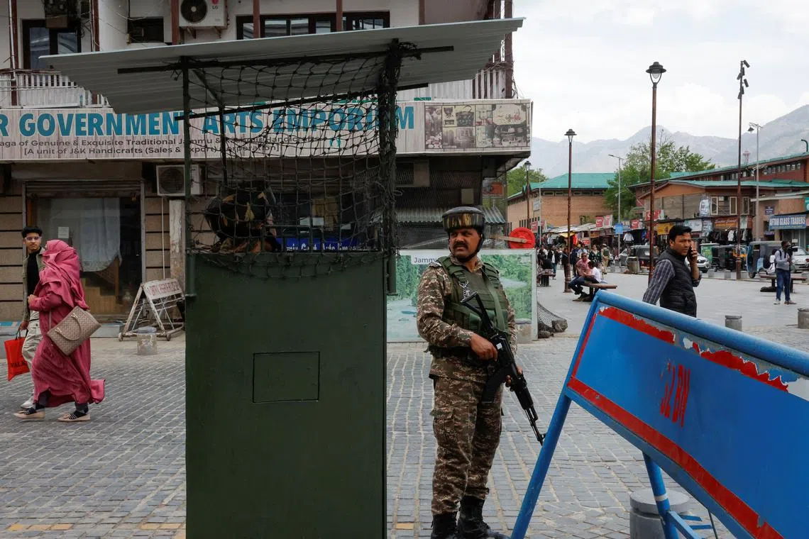 FILE PHOTO: An Indian security force personnel stands guards in a street, following a suspected militant attack near south Kashmir's Pahalgam, in Srinagar, April 26, 2025. REUTERS/Sharafat Ali