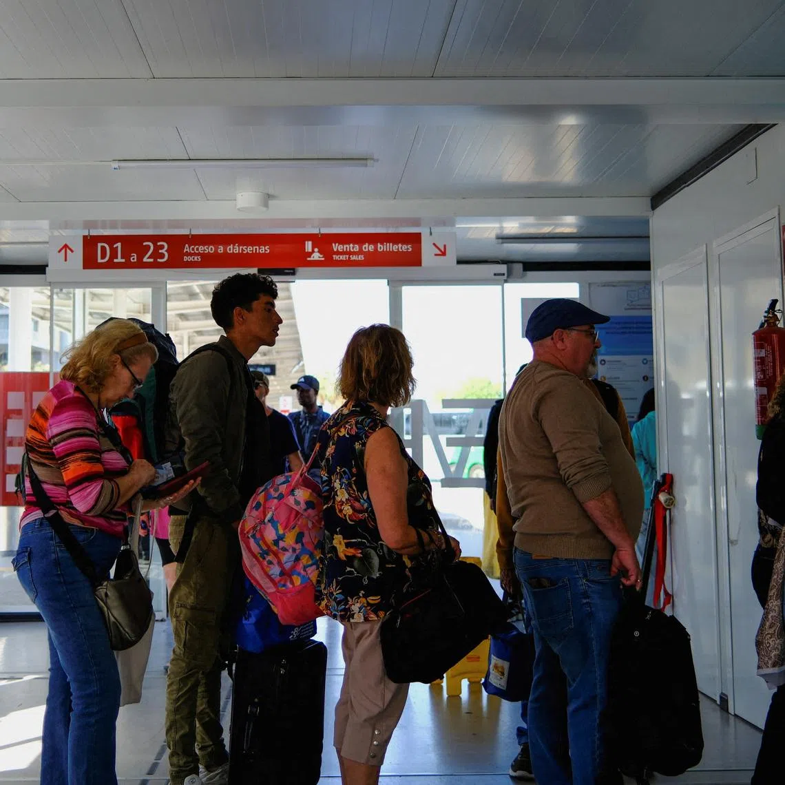Moroccan migrant Abdelmoujoud Erra, 27, queues to buy a bus ticket to Valladolid, to obtain a vulnerability certificate to regularise migration status, in Almeria Spain, April 22, 2026. REUTERS/Nacho Doce