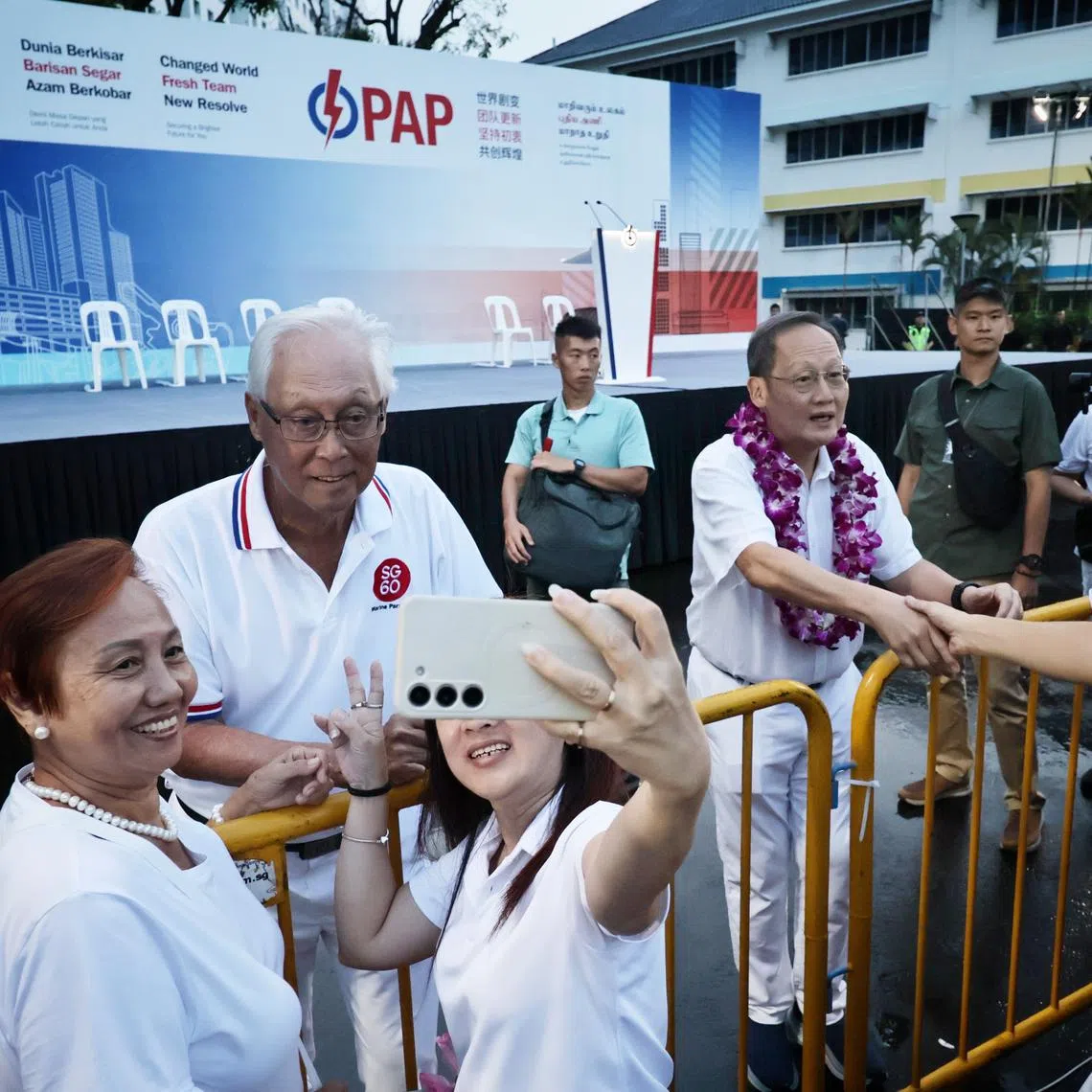 Emeritus Senior Minister Goh Chok Tong and Manpower Minister Tan See Leng greeting supporters before a PAP rally at Keat Hong Plaza on April 26.