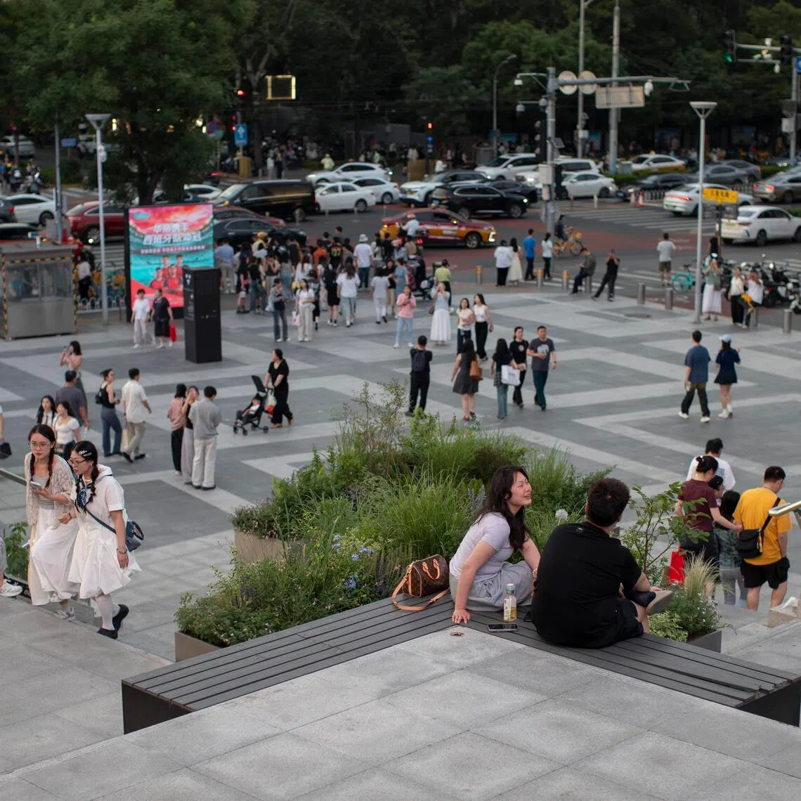 People stand outside a mall in Beijing, China, on May 31.