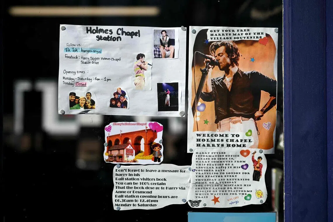 A poster of British singer Harry Styles is pictured at the train station in Holmes Chapel, north-west England, on March 4.