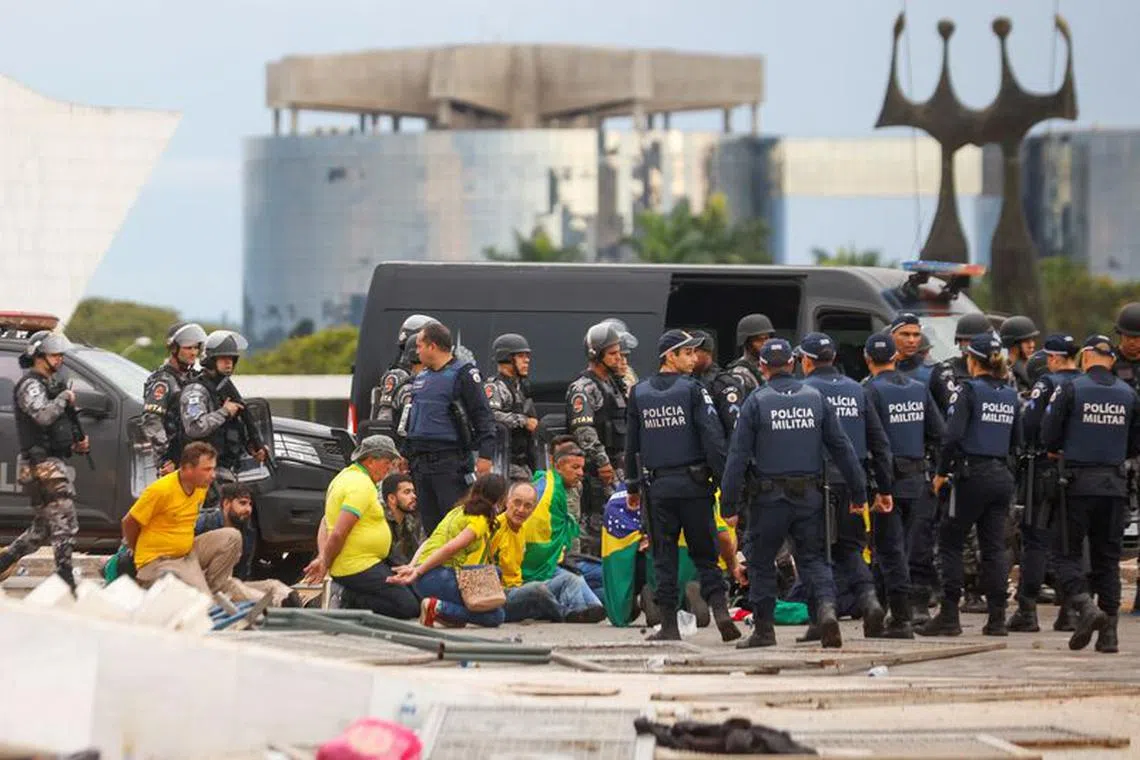 Security forces detain supporters of Brazil's former President Jair Bolsonaro during a demonstration against President Luiz Inacio Lula da Silva, in Brasilia, Brazil, January 8, 2023. REUTERS/Adriano Machado/File Photo