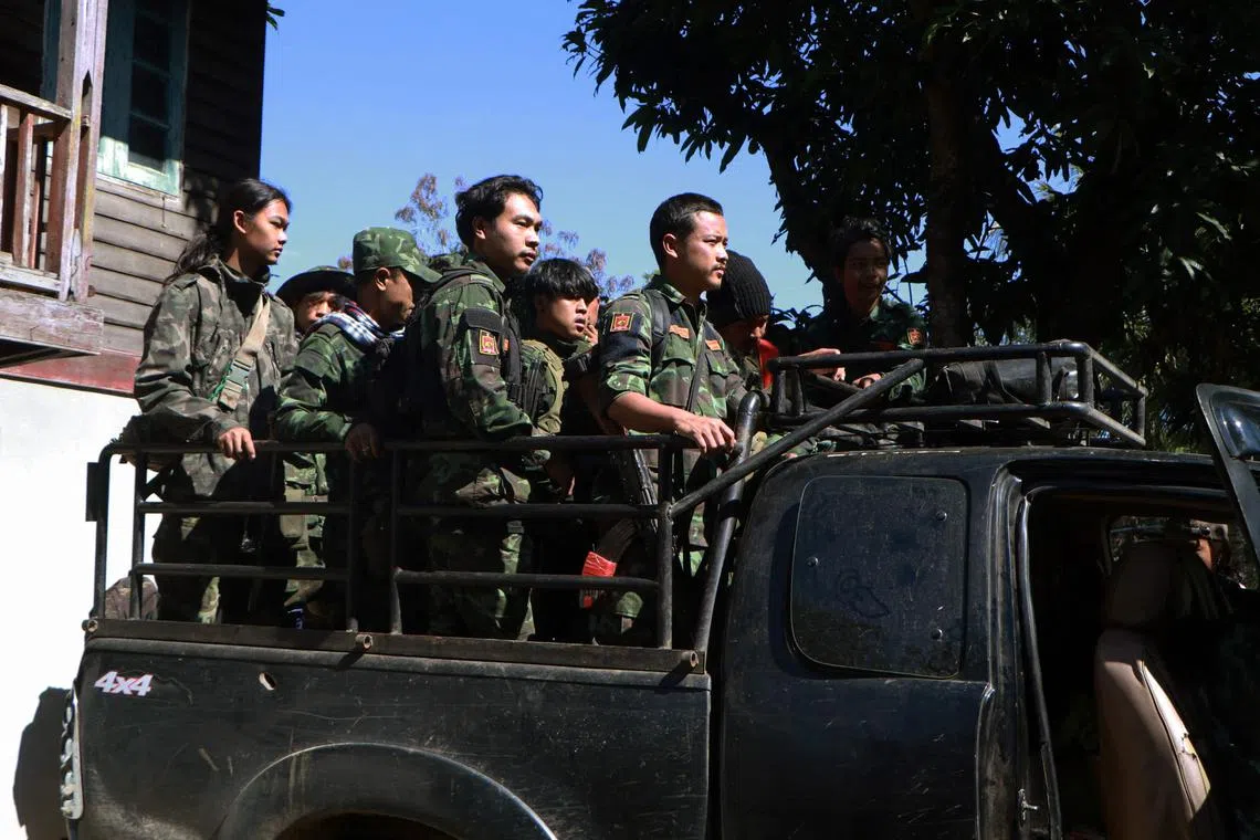 Members of the Loikaw People's Defence Force (PDF) preparing to go to the frontline near Loikaw in Myanmar's eastern Kayah state. 