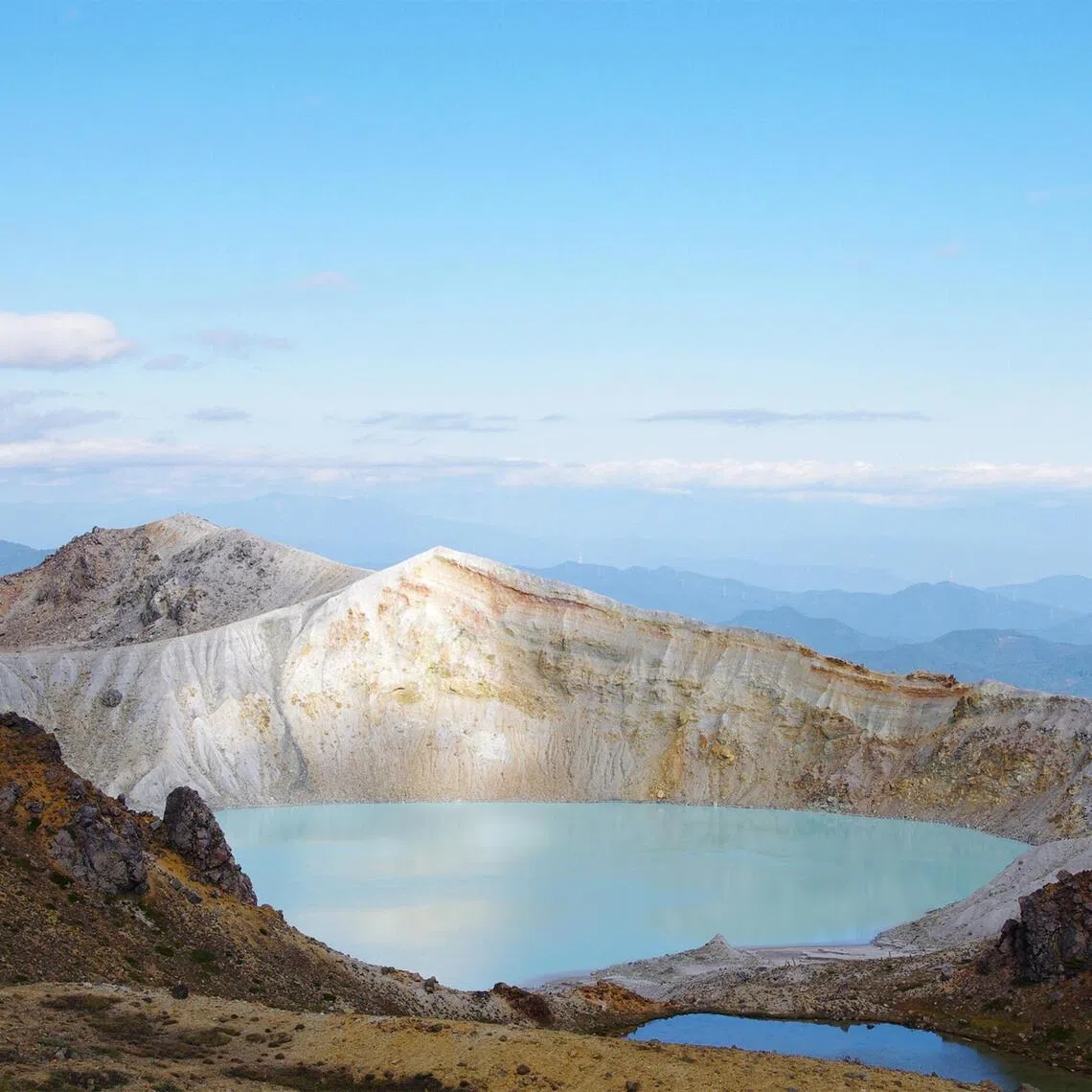 The emerald-green Yugama crater lake on Mount Kusatsu-Shirane, which straddles Gunma and Nagano prefectures.