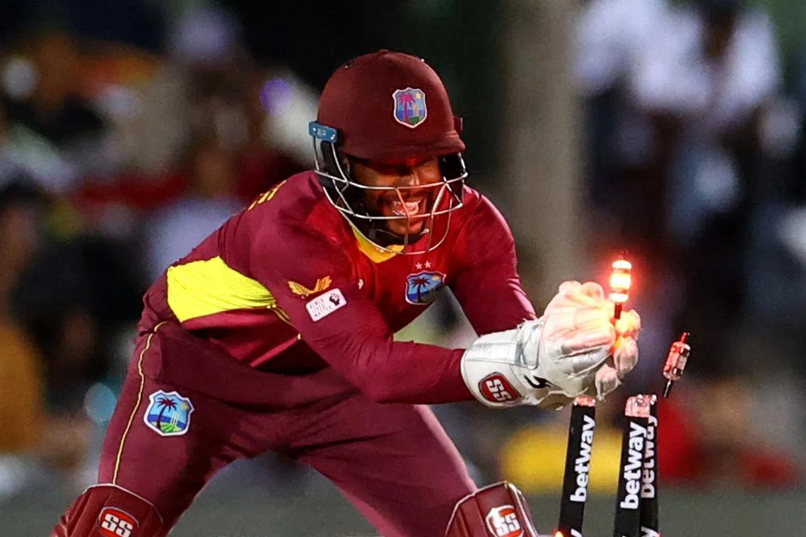 FILE PHOTO: Cricket - Second One Day International - South Africa v West Indies - Buffalo Park, East London, South Africa - March 18, 2023 West Indies' Shai Hope hits the bails to run out South Africa's Bjorn Fortuin REUTERS/Siphiwe Sibeko/File photo
