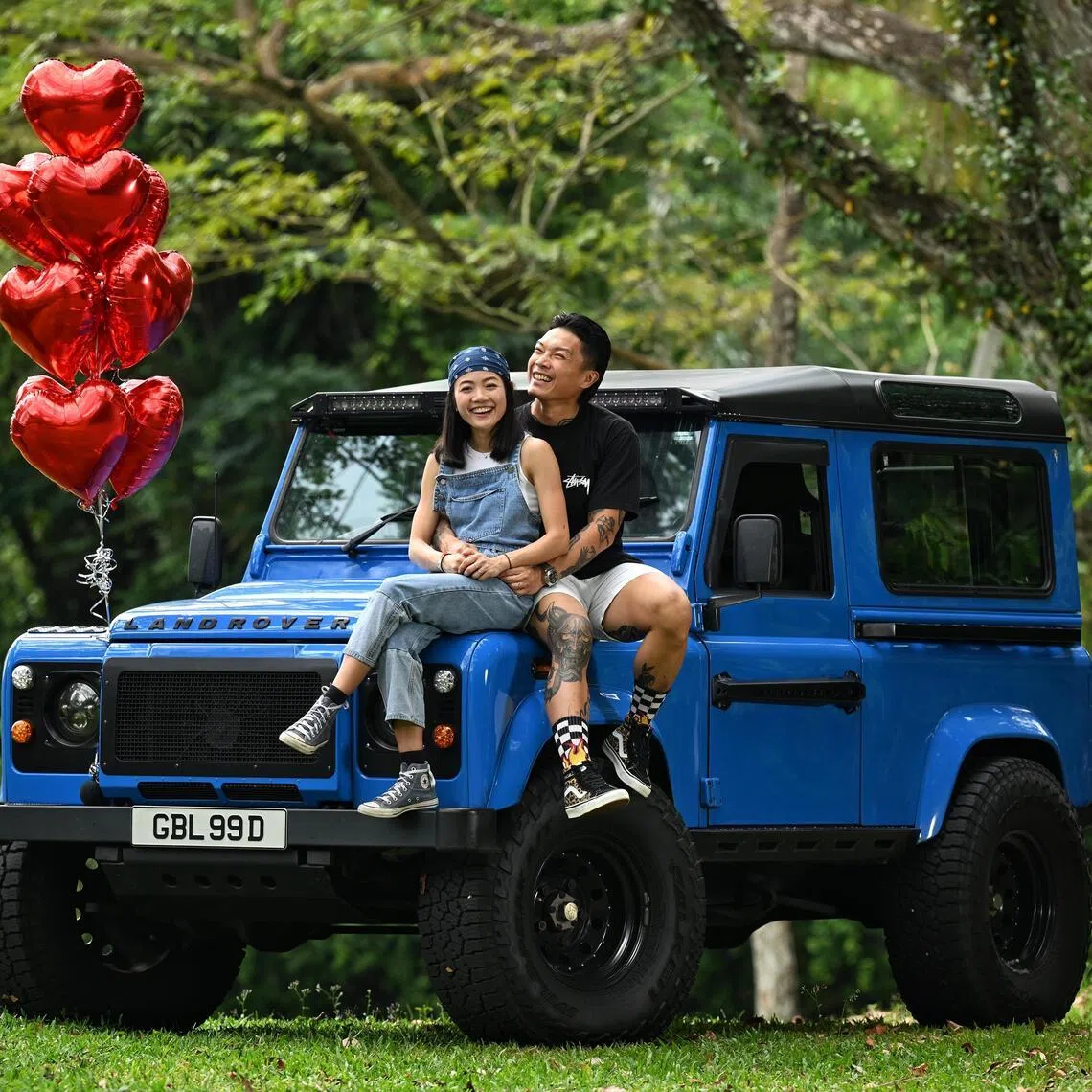 Newly weds Kelvin Ngian,41 and Charmaine Cheong, 32 with their Land Rover Defender 90 which saw them through their courtship days to serving as their bridal car when they married in November last year. They are photographed on Feb 8, 2026.