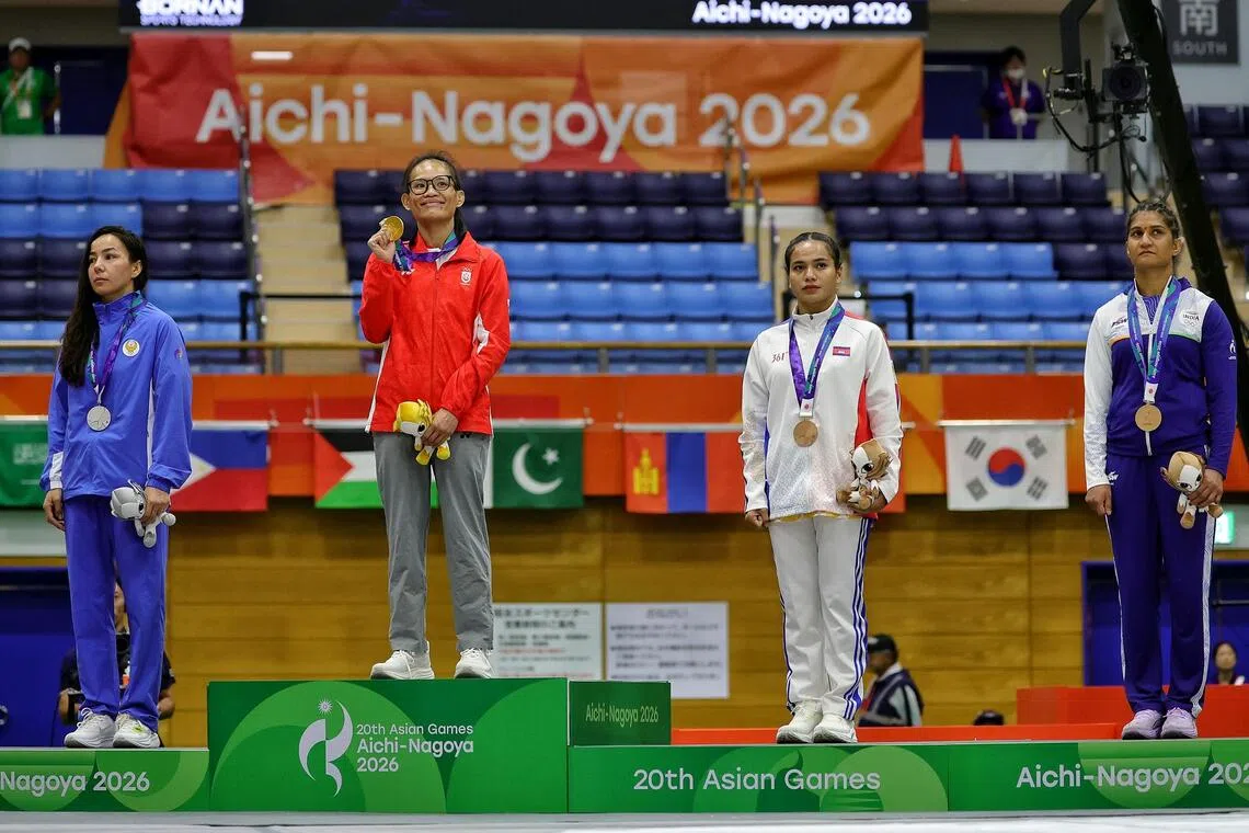 Gold medalist Tiffany Teo (second from left) of Singapore with (from left) silver medalist Khilola Sobirova of Uzbekistan, bronze medalists Cheng Dalin of Cambodia and Suchika Tariyal at the Nagoya City Inae Sports Centre in Nagoya, Japan on Sept 22.
