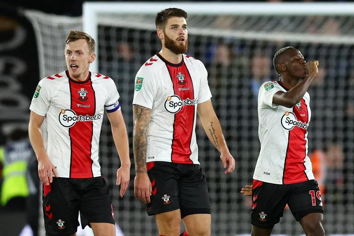 Southampton's Moussa Djenepo celebrates scoring their second goal with Duje Caleta-Car and James Ward-Prowse.