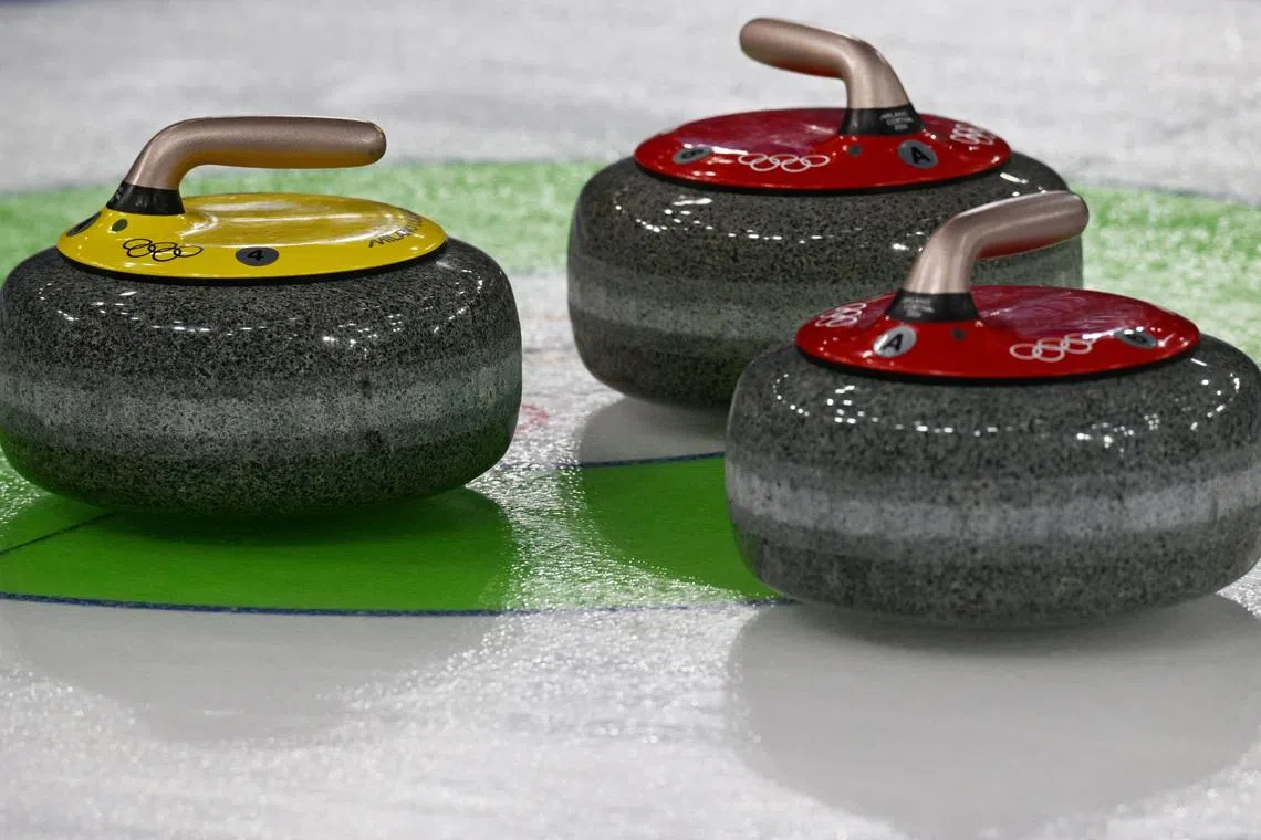 Milano Cortina 2026 Olympics - Curling - Women's Round Robin Session 5 - Canada vs Switzerland - Cortina Curling Olympic Stadium, Cortina d'Ampezzo, Italy - February 14, 2026. Team Canada's and Team Switzerland's stones on the rings during the match REUTERS/Jennifer Lorenzini