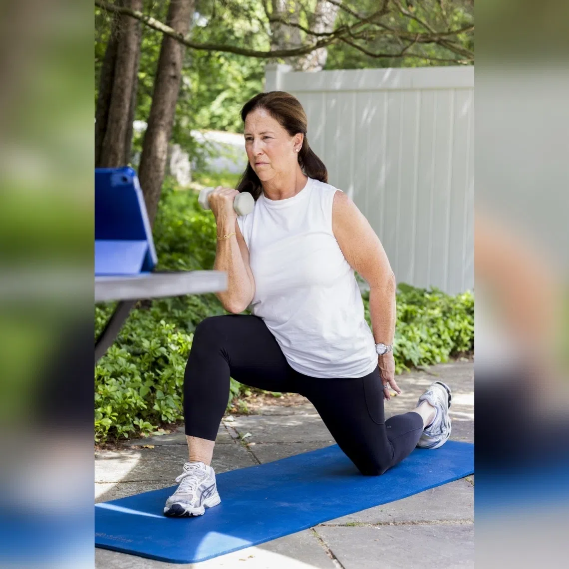 Liz Birenbaum, 60, works out at her home in Chappaqua, New York, on June 5.