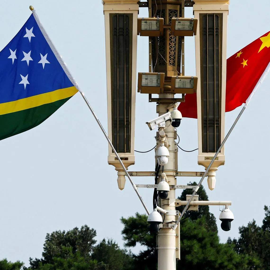 FILE PHOTO: Flags of Solomon Islands and China flutter near the Tiananmen Gate in Beijing, China July 11, 2023. REUTERS/Florence Lo/File Photo