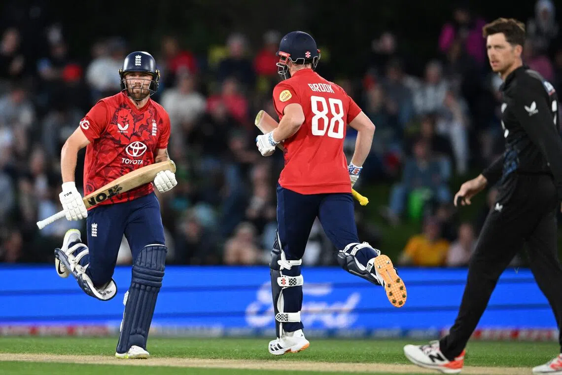 England's Phil Salt (left) and Harry Brook run between the wickets during the second Twenty20 international cricket match at Hagley Oval in Christchurch on Oct 20, 2025.