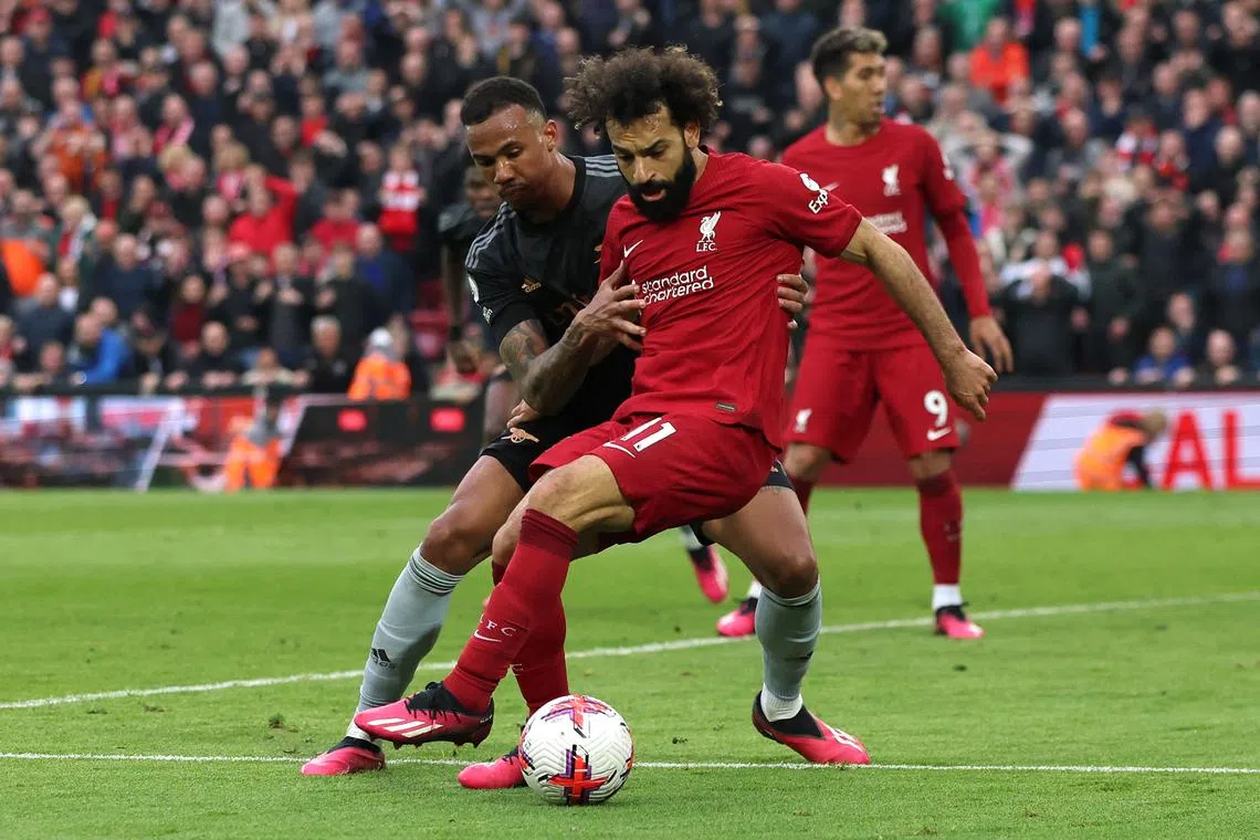 Liverpool's Mohamed Salah in action with Arsenal's Gabriel on Sunday.
