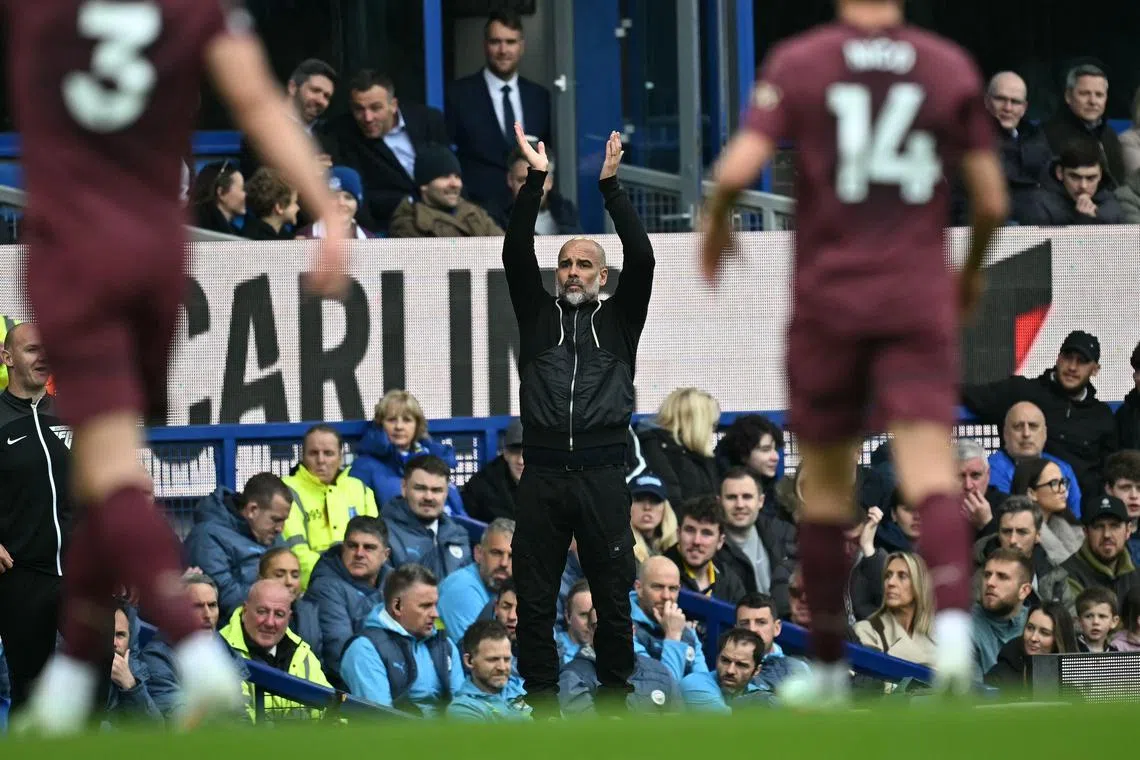 Manchester City manager Pep Guardiola gestures on the touchline during the Premier League match against Everton at Goodison Park.