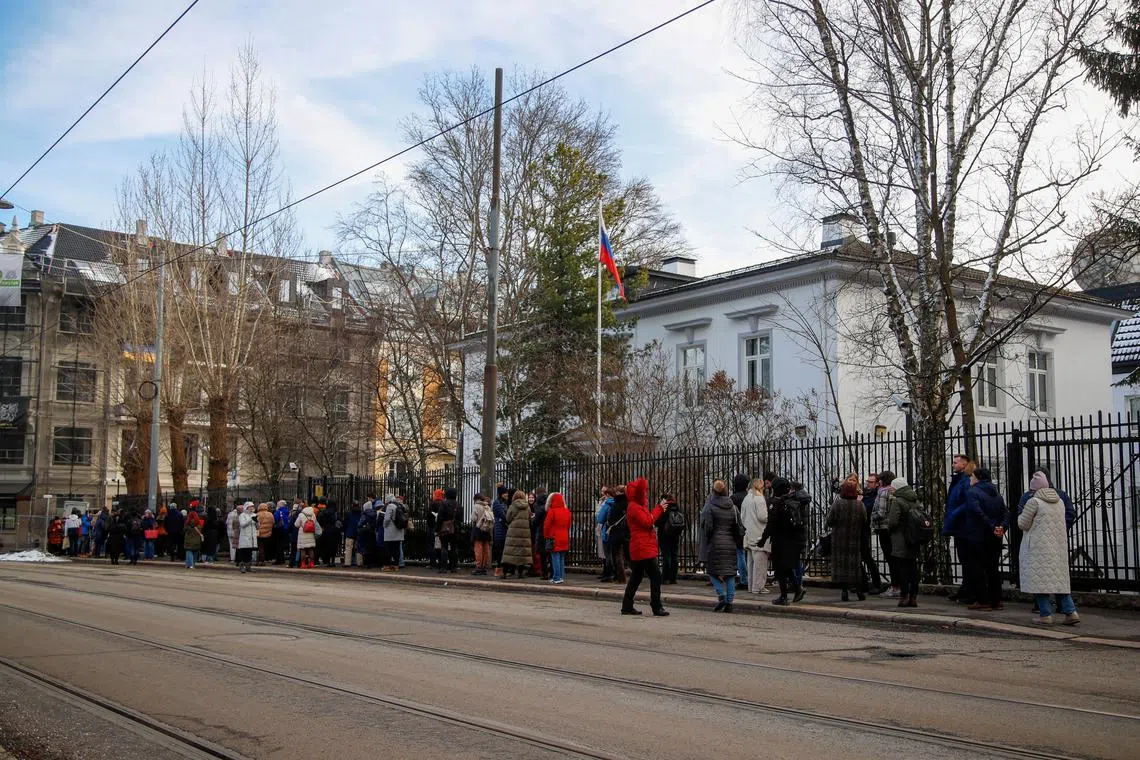 FILE PHOTO: Russians stand in a queue to vote, outside the Russian embassy in Oslo, Norway, March 17, 2024. NTB/Frederik Ringnes via REUTERS/File Photo
