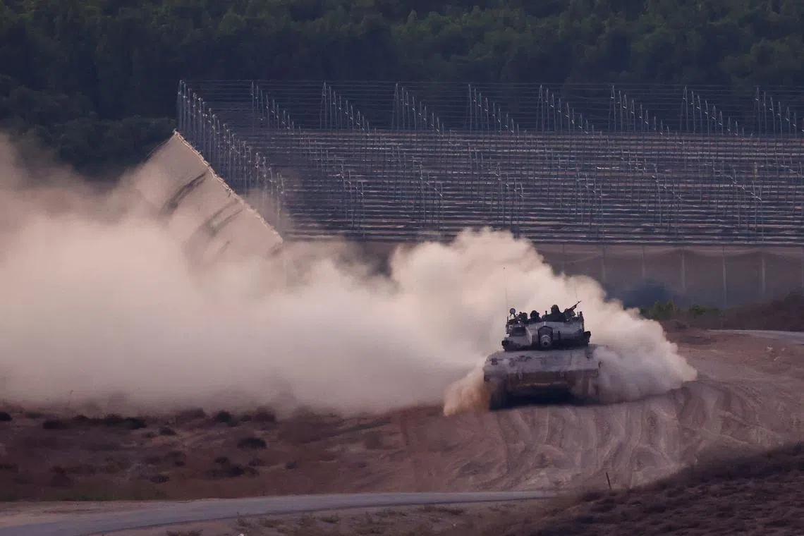 FILE PHOTO: A tank manoeuvres on the Israeli side of the Israel-Gaza border, amid the Israel-Hamas conflict, in Israel, September 5, 2024. REUTERS/Amir Cohen/File Photo