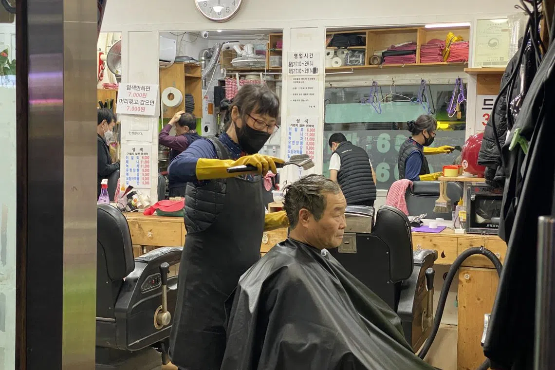A barbershop in Nakwon-dong in central Seoul, a neighbourhood often referred to as a place for older adults, in particular, those living on limited means.