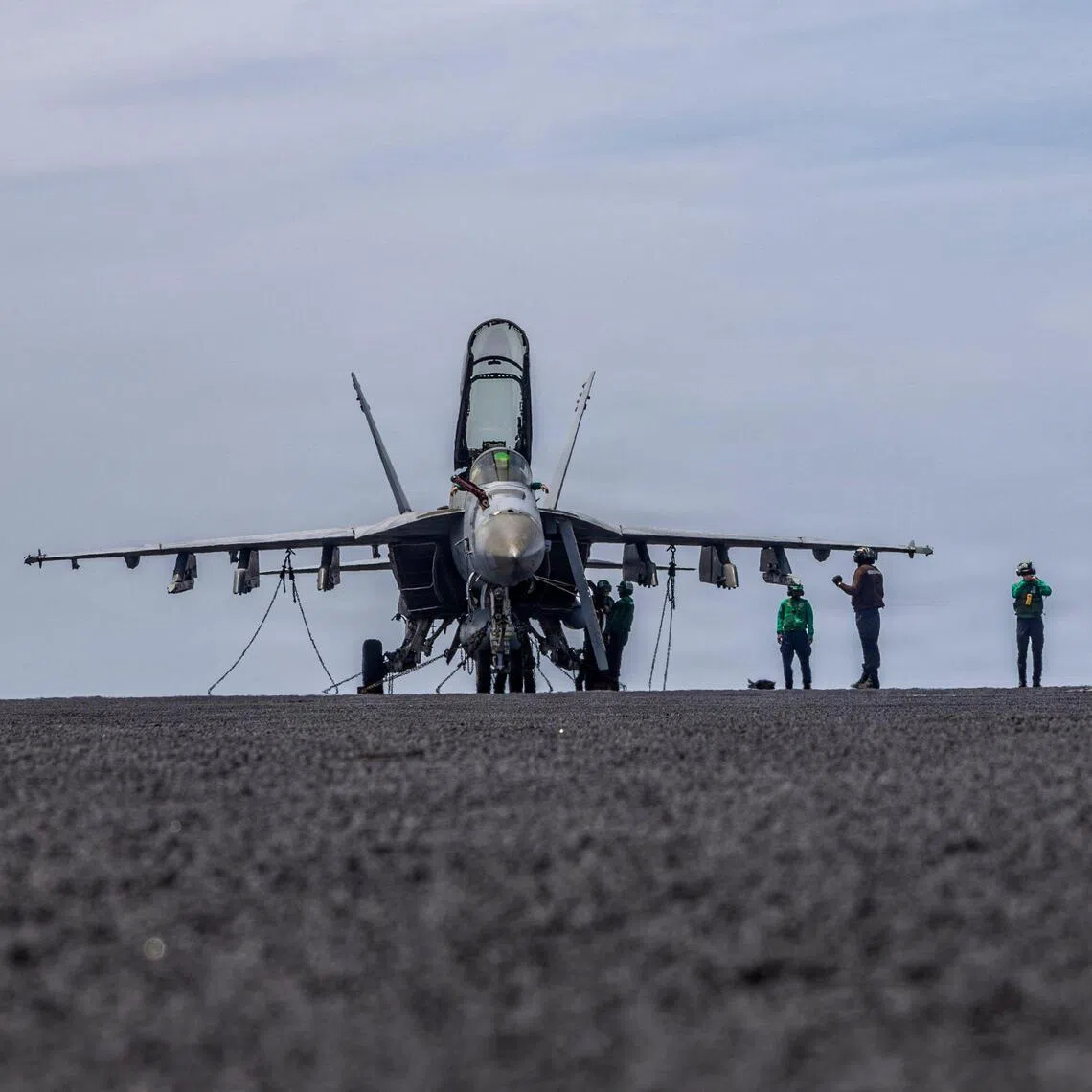A US Navy handout photo released on May 4 shows US sailors conducting maintenance on the flight deck of the USS Abraham Lincoln in April 2026. 
