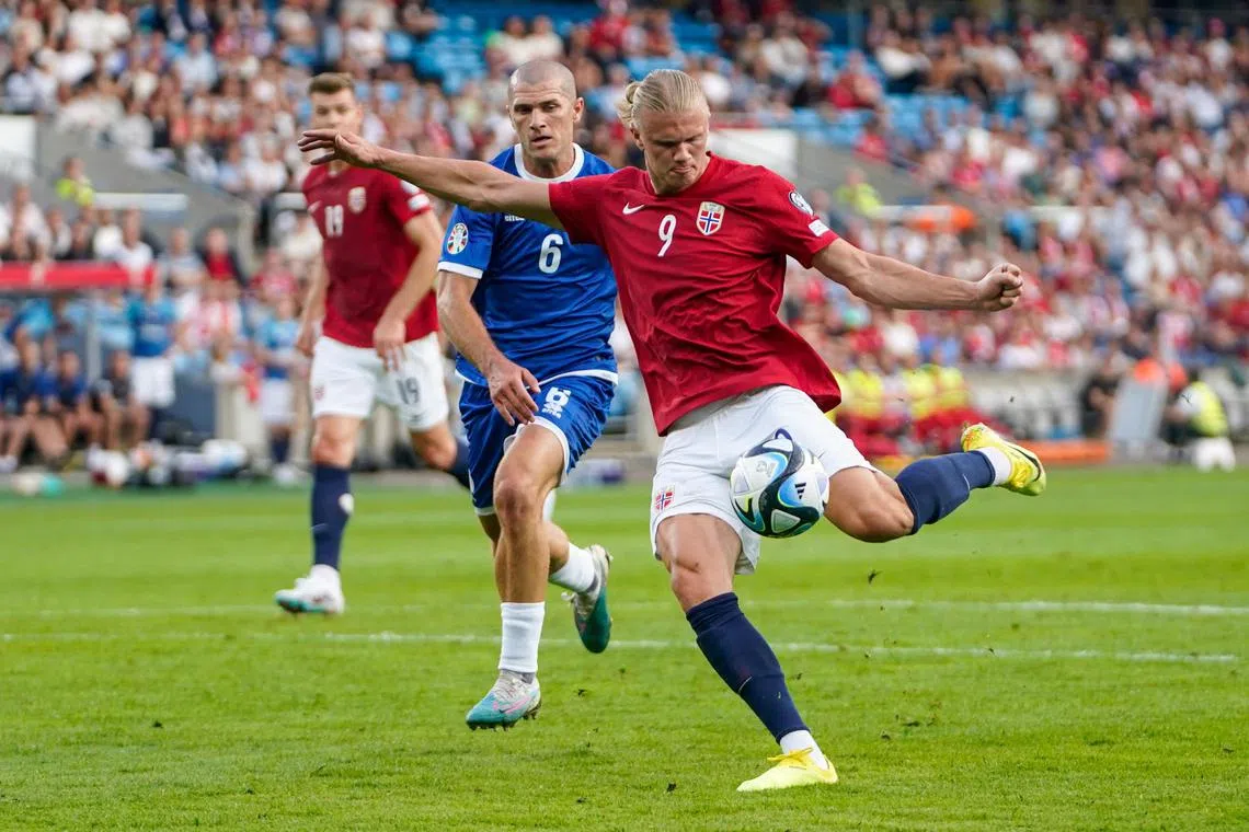 Erling Haaland of Norway taking a shot in the Euro 2024 qualifier against Cyprus. He scored two goals as the Norwegians won 3-1.