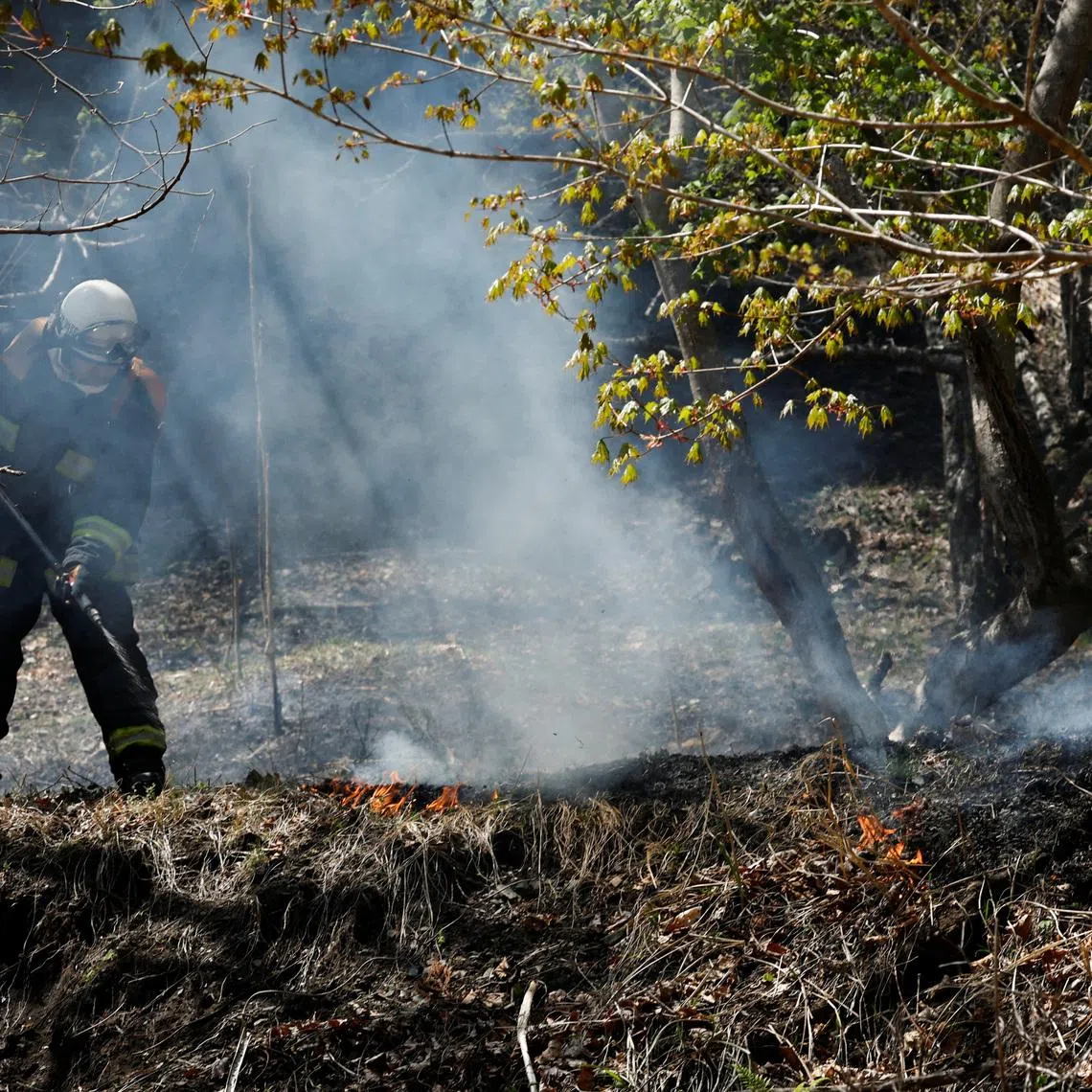 A firefighter works as wildfires continue in Otsuchi, Iwate Prefecture, Japan, April 26, 2026. REUTERS/Kim Kyung-Hoon
