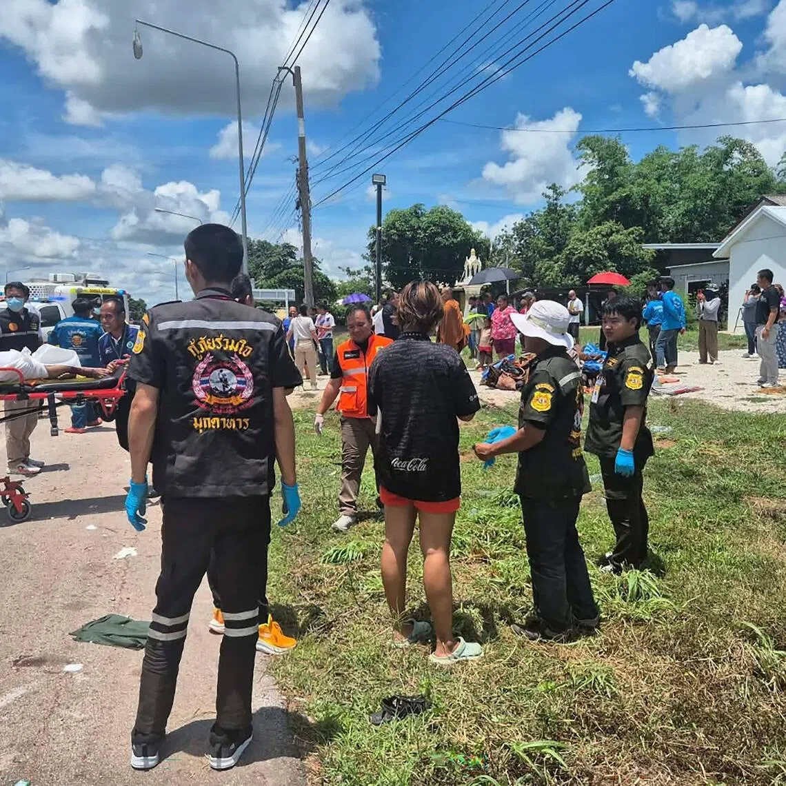 Rescue workers retrieving the body of a Buddhist monk after a collision between the monks’ roadside procession and a pickup truck driven by an 11-year old on July 2.