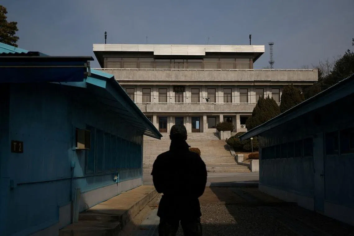 FILE PHOTO: A South Korean soldier stands guard in the truce village of Panmunjom inside the demilitarized zone (DMZ) separating the two Koreas, South Korea, February 7, 2023.   REUTERS/Kim Hong-Ji/File Photo