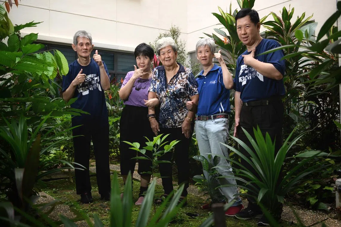 Madam Ng Gim (centre) is a mother and sole caregiver to her four adult children with intellectual disability: (from left) Lee Eng Ang, Lee Bee Lan, Lee Peng Peng and Lee Eng Chwee.