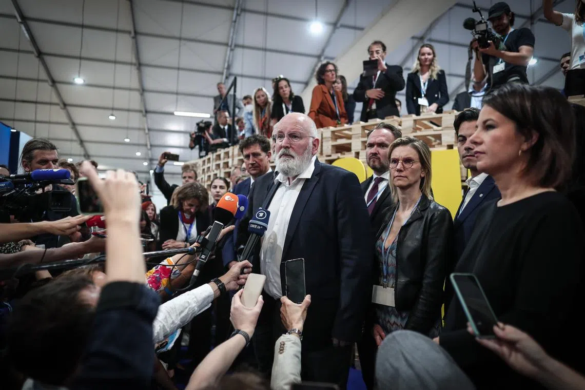 epa10313900 Members of the media listen as European Commission Vice-President in charge of the European Green Deal Frans Timmermans (C) speaks at the 2022 United Nations Climate Change Conference (COP27), in Sharm El-Sheikh, Egypt, 19 November 2022. The 2022 United Nations Climate Change Conference (COP27), runs from 06 to 18 November, and is expected to host one of the largest number of participants in the annual global climate conference as over 40,000 estimated attendees, including heads of states and governments, civil society, media and other relevant stakeholders will attend. The events will include a Climate Implementation Summit, thematic days, flagship initiatives, and Green Zone activities engaging with climate and other global challenges.  EPA-EFE/SEDAT SUNA