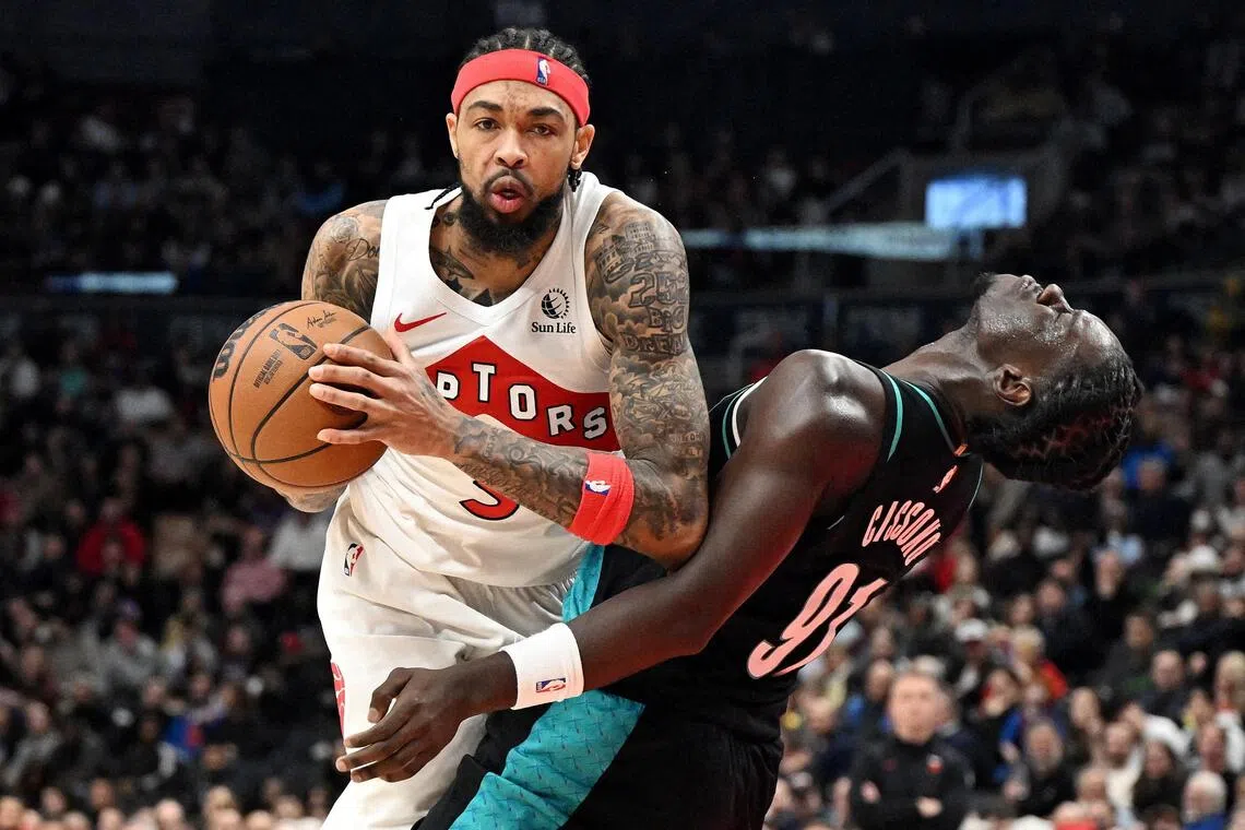 Toronto Raptors forward Brandon Ingram fouls Portland Trail Blazers forward Sidy Cissoko in the second half at Scotiabank Arena. 