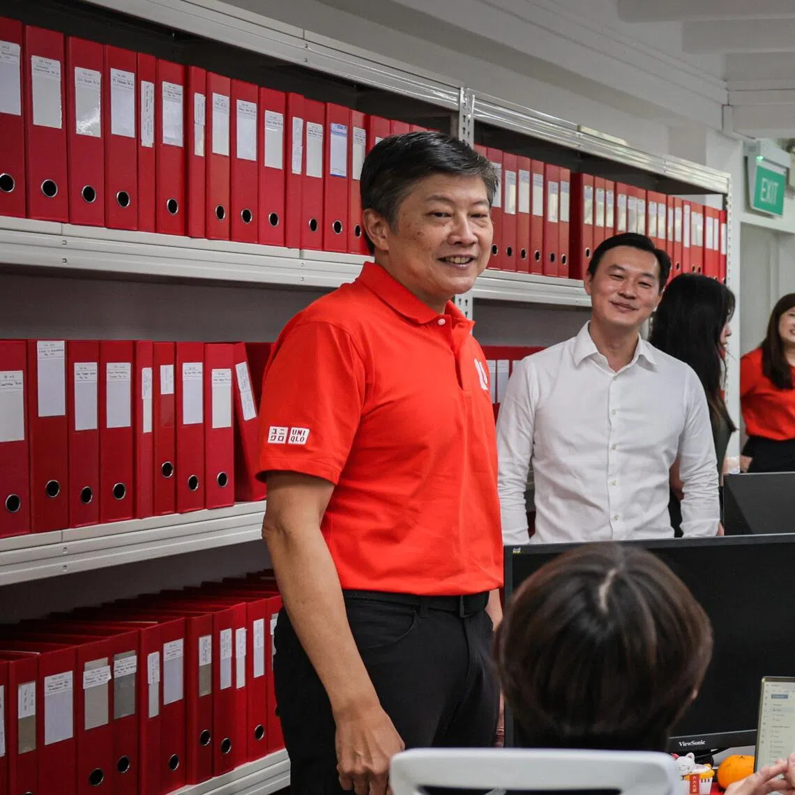 NTUC Secretary-General (SG) Ng Chee Meng (left) interacting with SIN Assurance PAC workers during a visit to the SIN Assurance PAC office on Feb 9, 2026.