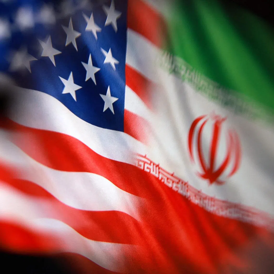 U.S. and Iranian flags are seen in this illustration taken March 23, 2026. REUTERS/Dado Ruvic/Illustration