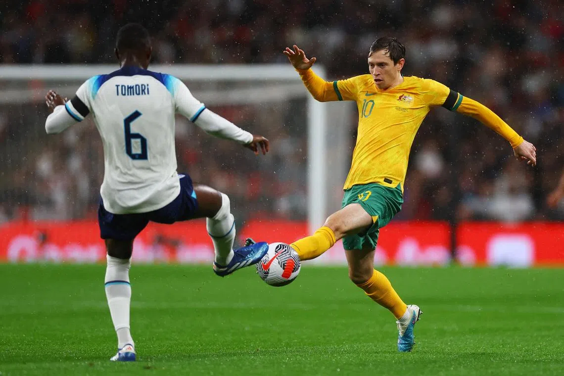 Soccer Football - International Friendly - England v Australia - Wembley Stadium, London, Britain - October 13, 2023 England's Fikayo Tomori in action with Australia's Craig Goodwin. Action Images via Reuters/Matthew Childs