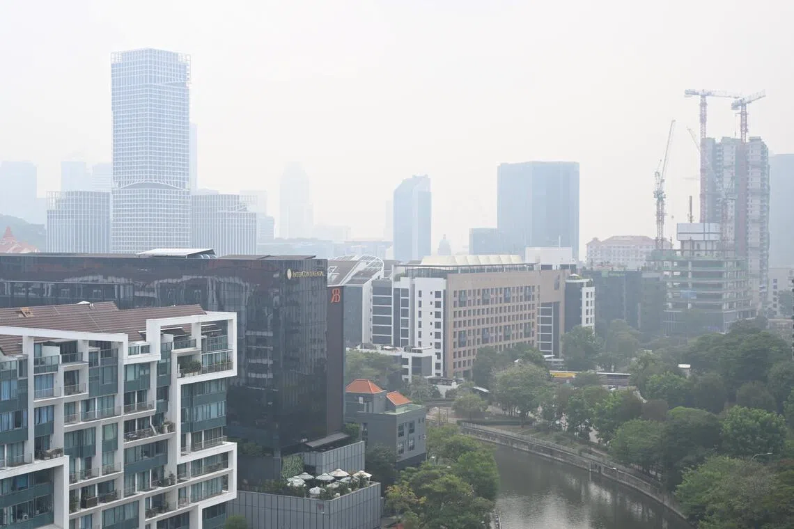 Haze seen from Robertson Quay towards the Singapore River and downtown at about 10am on Sept 14, 2026. The 24 hr PSI in the South is 81 ST PHOTO: Chong Jun Liang