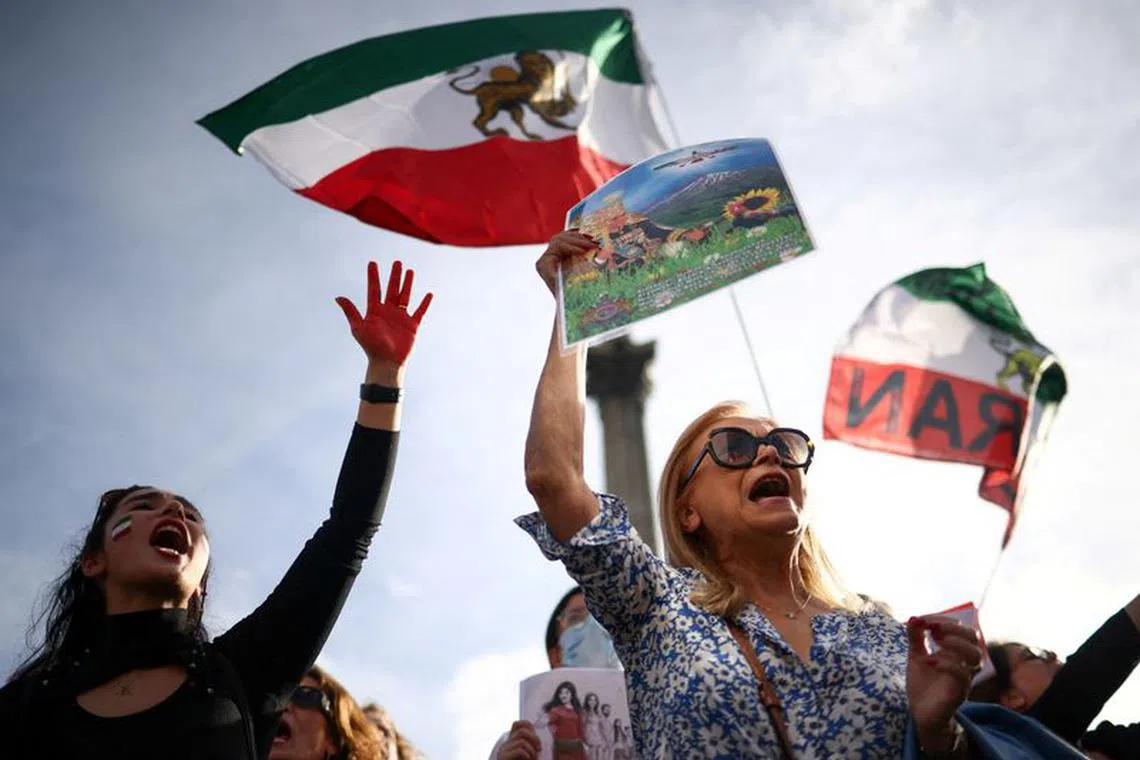 FILE PHOTO: People protest following the death of Mahsa Amini in Iran, in London, Britain October 29, 2022. REUTERS/Henry Nicholls/File Photo