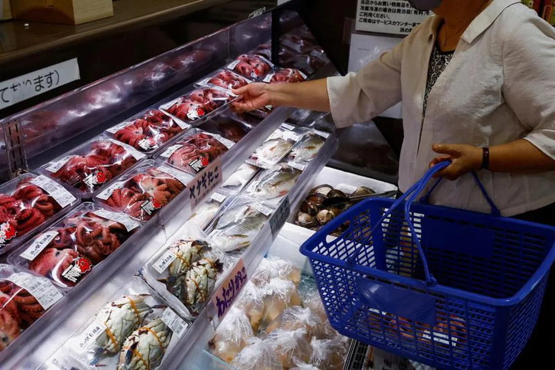 A customer browses through locally caught seafood at the Hamanoeki Fish Market and Food Court in Soma, Fukushima Prefecture, Japan, August 31, 2023. REUTERS/Kim Kyung-Hoon