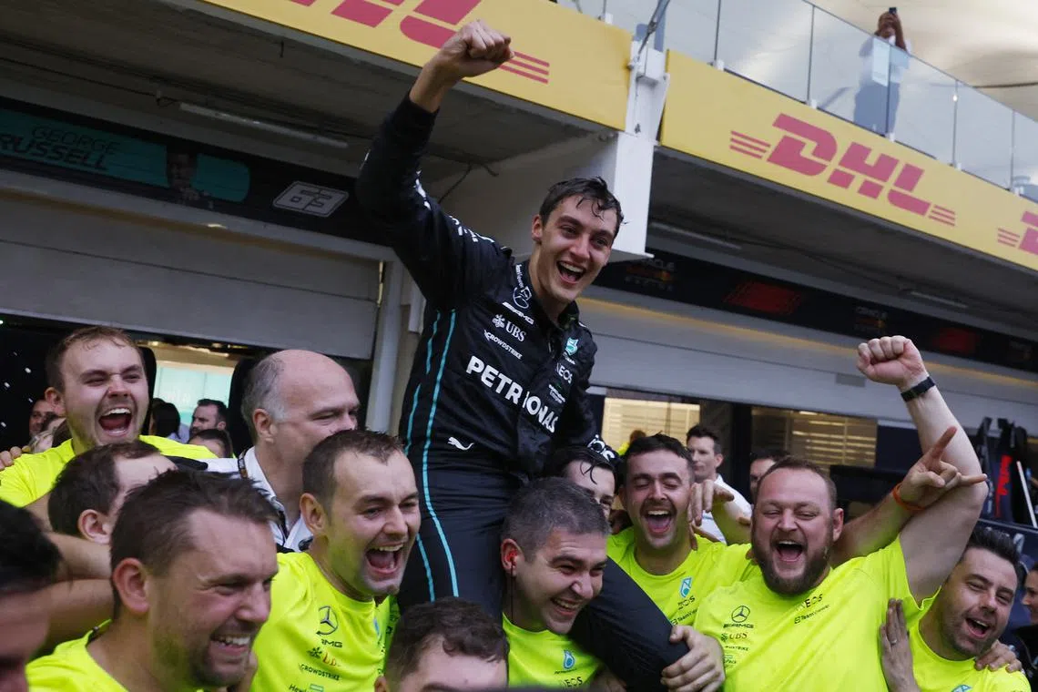 Formula One F1 - Brazilian Grand Prix - Jose Carlos Pace Circuit, Sao Paulo, Brazil - November 13, 2022
Mercedes' George Russell celebrates after winning the race with teammates REUTERS/Amanda Perobelli