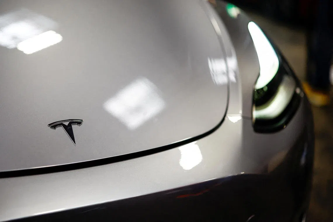FILE PHOTO: The Tesla logo is seen on a car at the Paris Games Week (PGW), a trade fair for video games in Paris, France, October 27, 2024. REUTERS/Sarah Meyssonnier/File Photo