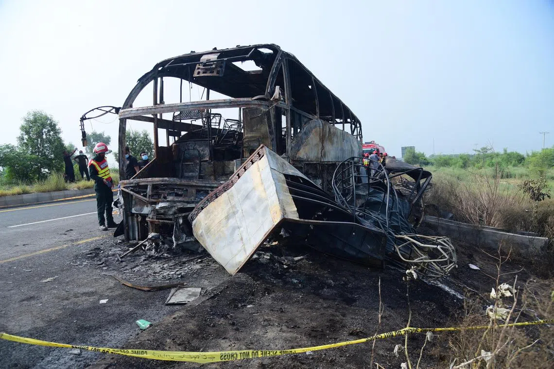 A bus is reduced to its metal frame after it crashed into a truck carrying diesel and petrol in Pakistan.