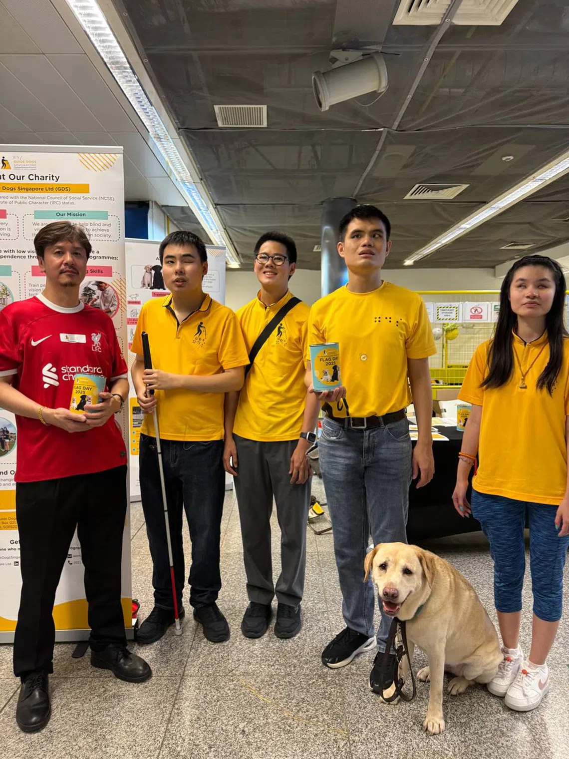 Volunteers at a Guide Dogs Singapore flag day.