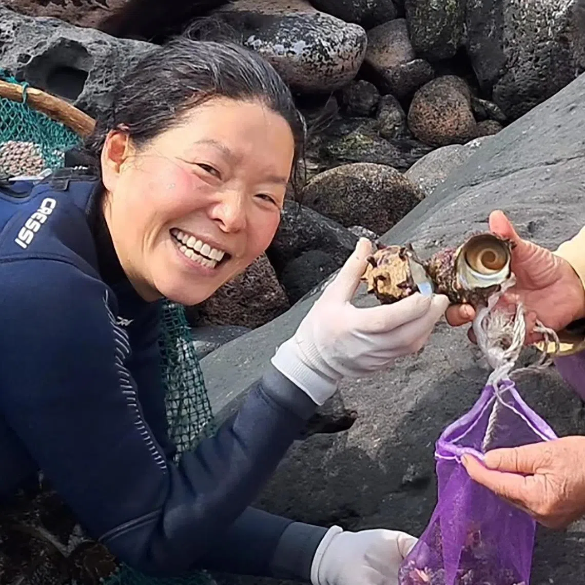 Mdm Choi Soon-duk with her 93-year-old haenyeo mentor. The Jeju haenyeo community is known for its tight-knit and matrilineal structure.