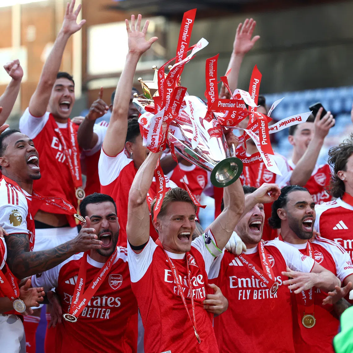 FILE PHOTO: Soccer Football - Premier League - Crystal Palace v Arsenal - Selhurst Park, London, Britain - May 24, 2026 Arsenal's Martin Odegaard lifts the trophy as he celebrates with teammates after winning the Premier League Action Images via Reuters/Matthew Childs EDITORIAL USE ONLY. NO USE WITH UNAUTHORIZED AUDIO, VIDEO, DATA, FIXTURE LISTS, CLUB/LEAGUE LOGOS OR 'LIVE' SERVICES. ONLINE IN-MATCH USE LIMITED TO 120 IMAGES, NO VIDEO EMULATION. NO USE IN BETTING, GAMES OR SINGLE CLUB/LEAGUE/PLAYER PUBLICATIONS. PLEASE CONTACT YOUR ACCOUNT REPRESENTATIVE FOR FURTHER DETAILS../File Photo