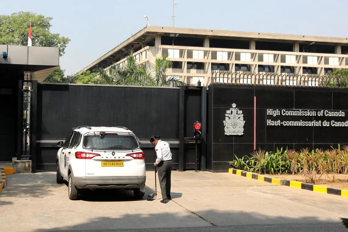 epa11659935 A security official checks a car outside the Canadian Embassy in New Delhi, India, 15 October 2024. The Indian government expelled six Canadian diplomats after a diplomatic communication from Canada suggesting that the Indian High Commissioner and other diplomats are 'persons of interest' in a matter related to an investigation in that country, stated a Ministry of External Affairs press release.  EPA-EFE/RAJAT GUPTA