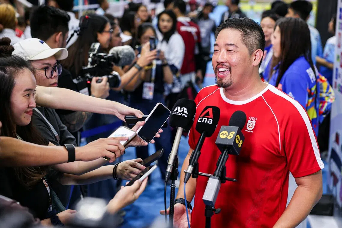Singapore national team's swimming coach Gary Tan in high spirits at the end of the swimming events at the 33rd SEA Games, held at the SAT swimming pool in Bangkok on Dec 15, 2025. ST PHOTO: BRIAN TEO
