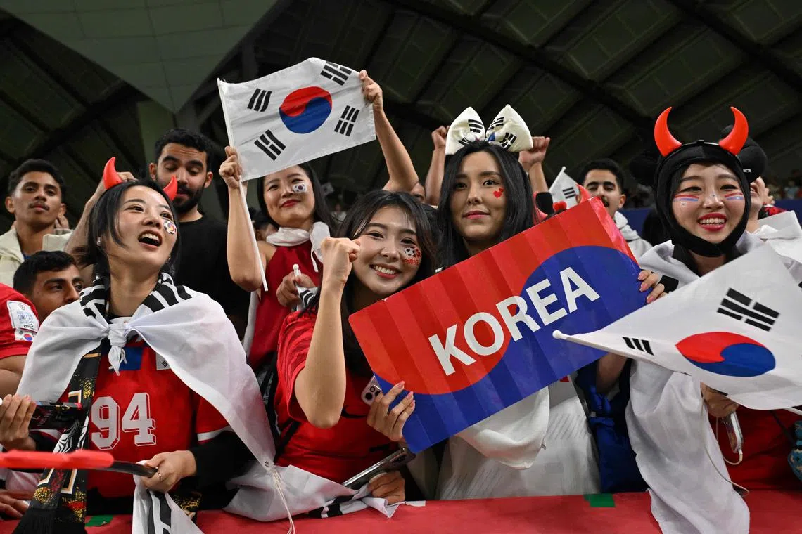 South Korea's female supporters celebrate after their team beat Australia in the Asian Cup.