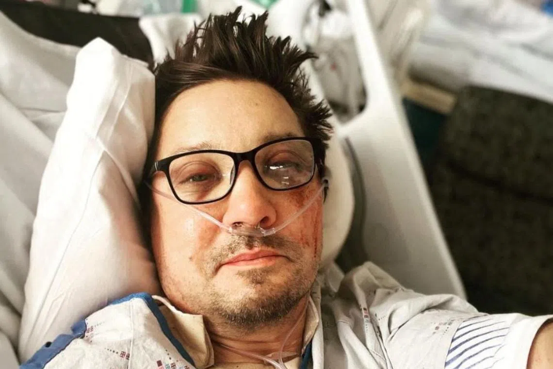 A screen grab shows a selfie of actor Jeremy Renner on a hospital bed, in this picture obtained from social media on Jan 3, 2023. 